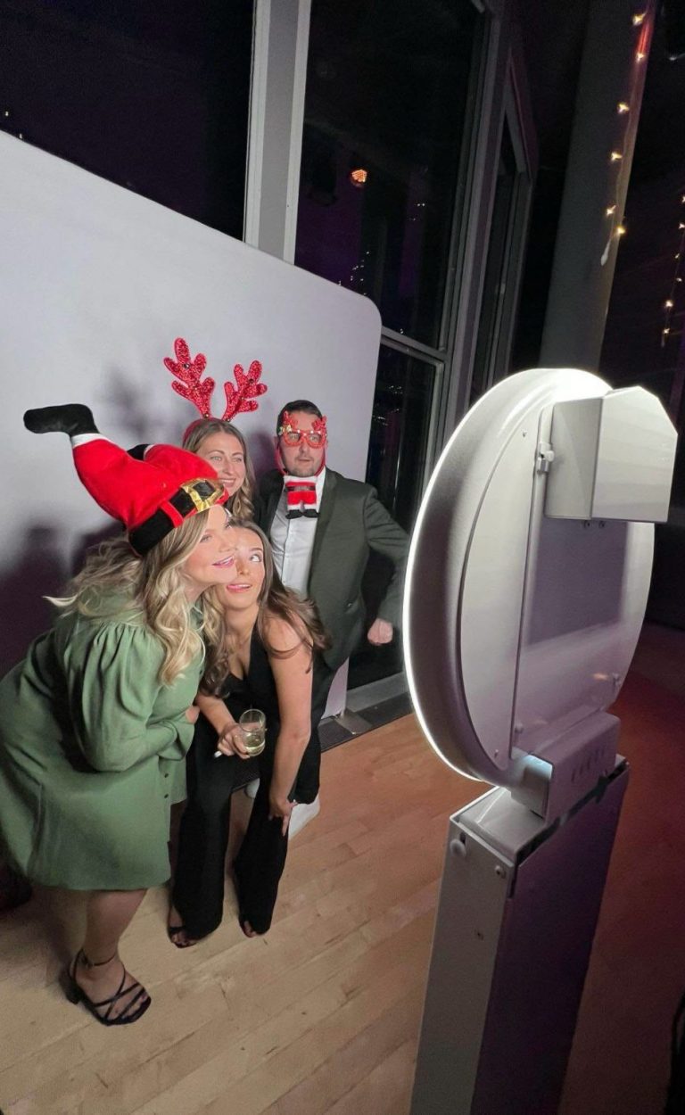 Smile-and-pose-Photo-Booth-Hire-Manchester-corporate-event-party.Photo-Booth-Hire-Manchester-selfie-pod-white-ipad-christmas-party